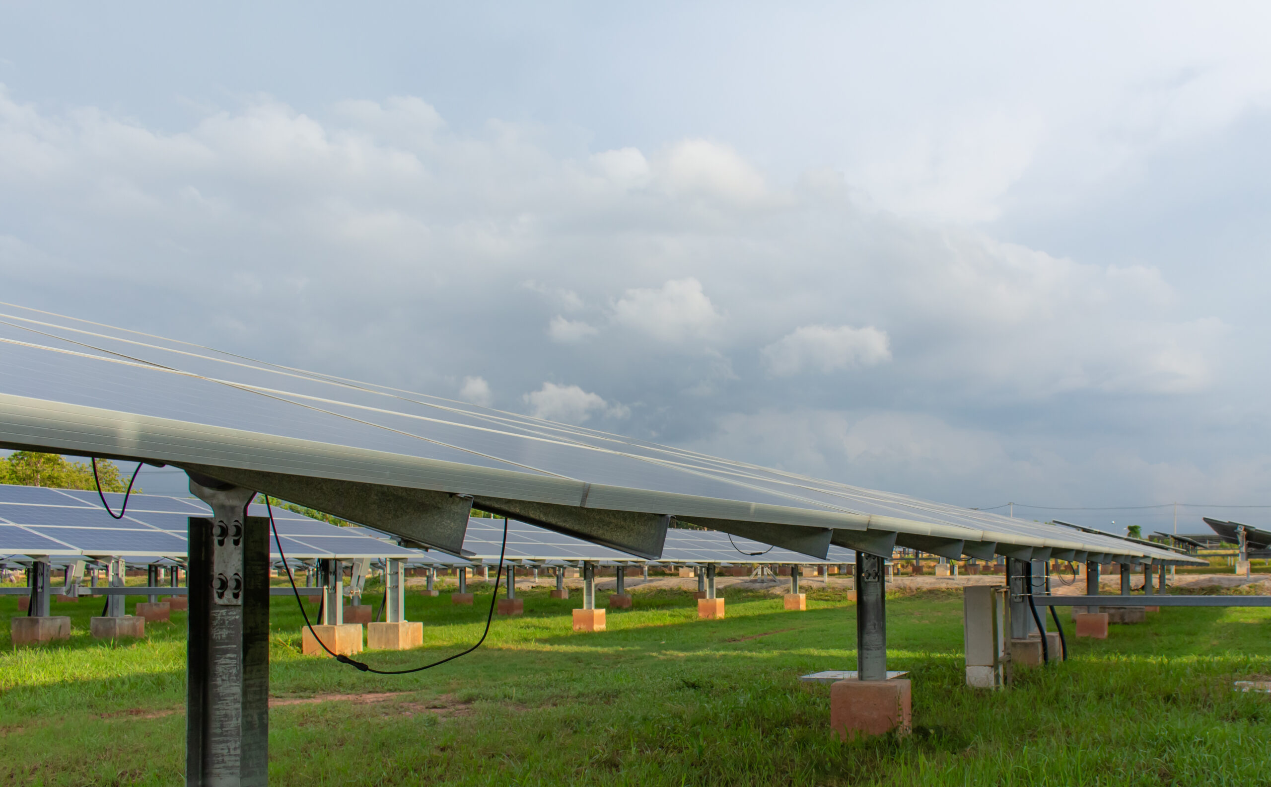 Large number of solar cell panels on white clouds background,